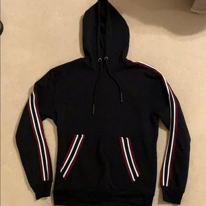 Black sweatshirt with red and white stripes